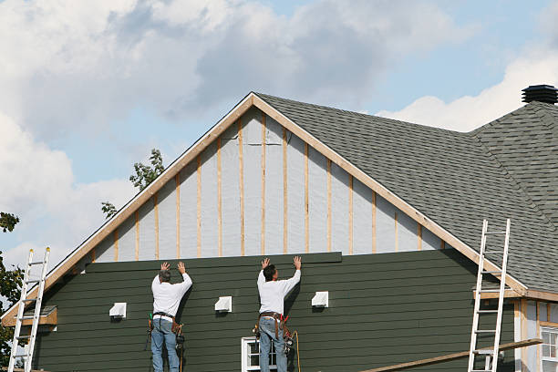 Professional Storm Damage Siding Repair technician working in Brentwood, NY